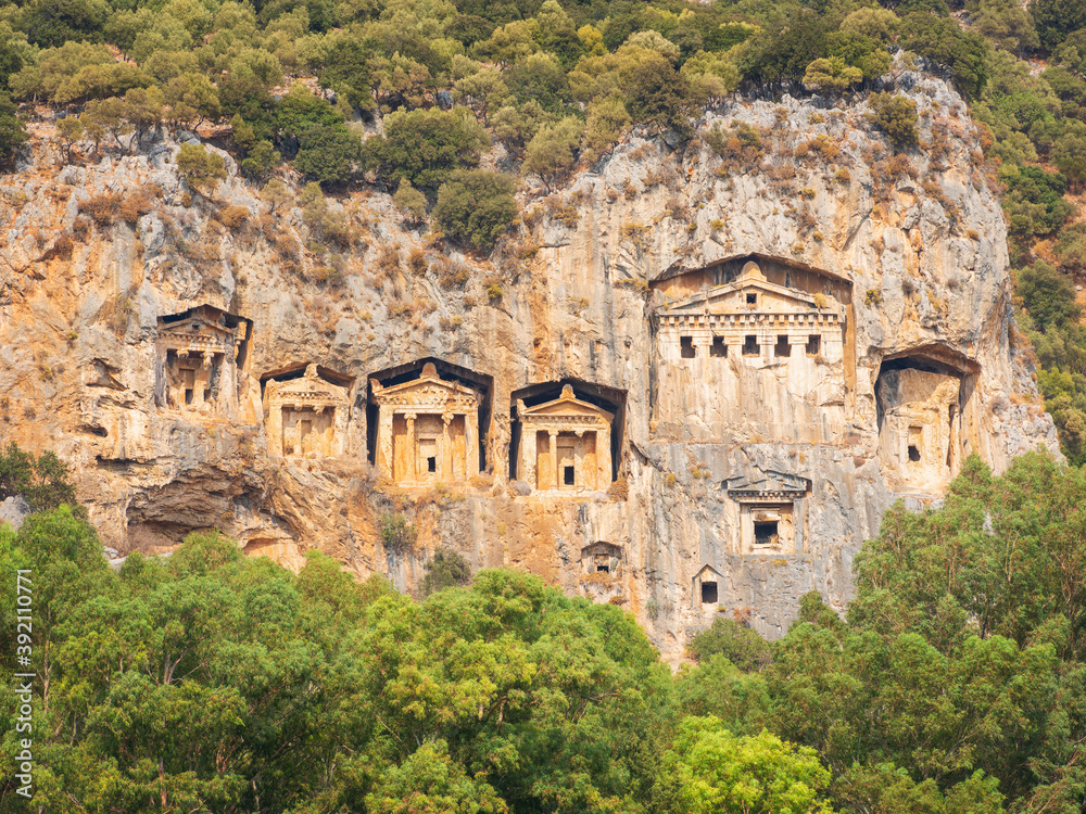 view to central facade of antique tombs in rock caves in Turkey