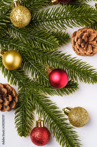 Christmas composition. Colorful ornament, baubles and fir needles decorations, top view