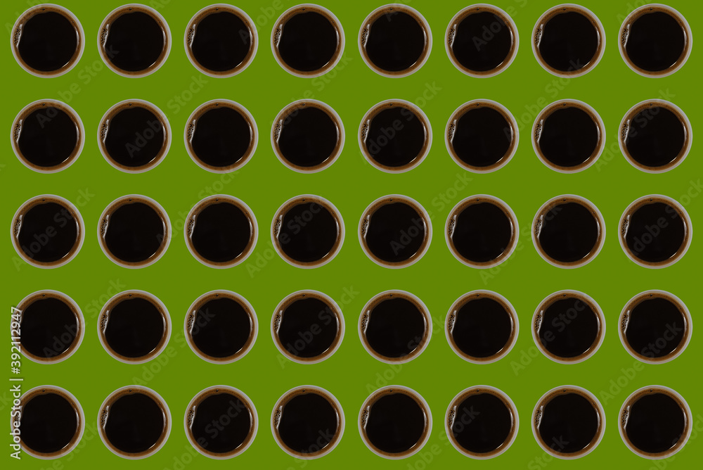 pattern with cups of black espresso coffee on olive green background pattern with cups of black espresso coffee on olive green background