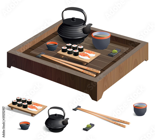 Japanese sushi with soy sauce, wasabi, chopsticks, and green tea on a wooden trivet with a bamboo mat  