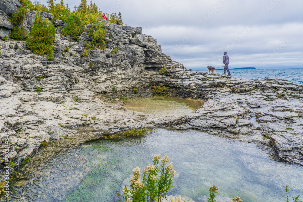 To the grotto, a natural wonder in Bruce Peninsula National Park. This park is protecting a rugged shore of the Lake Huron with turquoise blue waters
