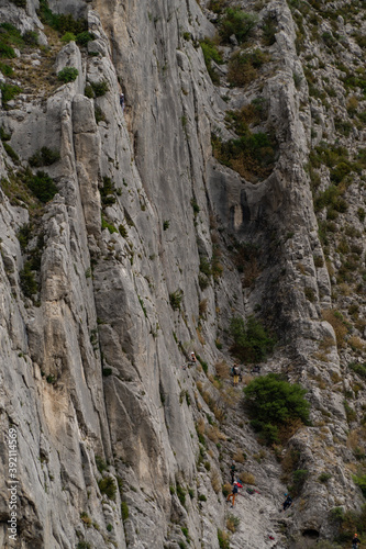 Steep cliff and some mountaineers, in Sisteron, French Alps