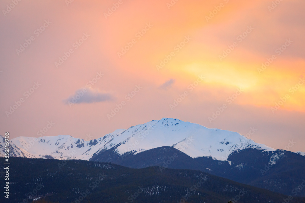 Snow capped mountain peak during sunset in Apraho National Forest, Colorado