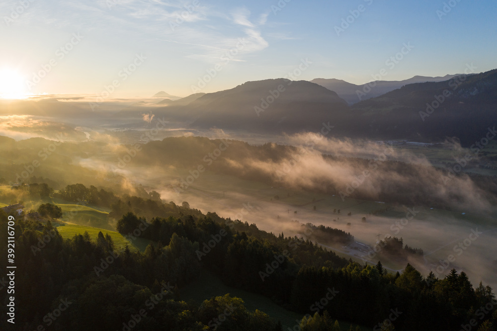 Naklejka premium Drone panorama over Tyrol landscape, at sunrise in Austria.