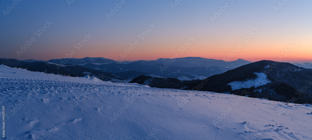 Picturesque winter alps sunrise. Panoramic mountains view from Svydovets ridge and Dragobrat ski resort.
