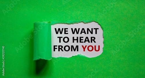 The words 'we want to hear from you' appearing behind torn green paper. Beautiful background. Business concept.