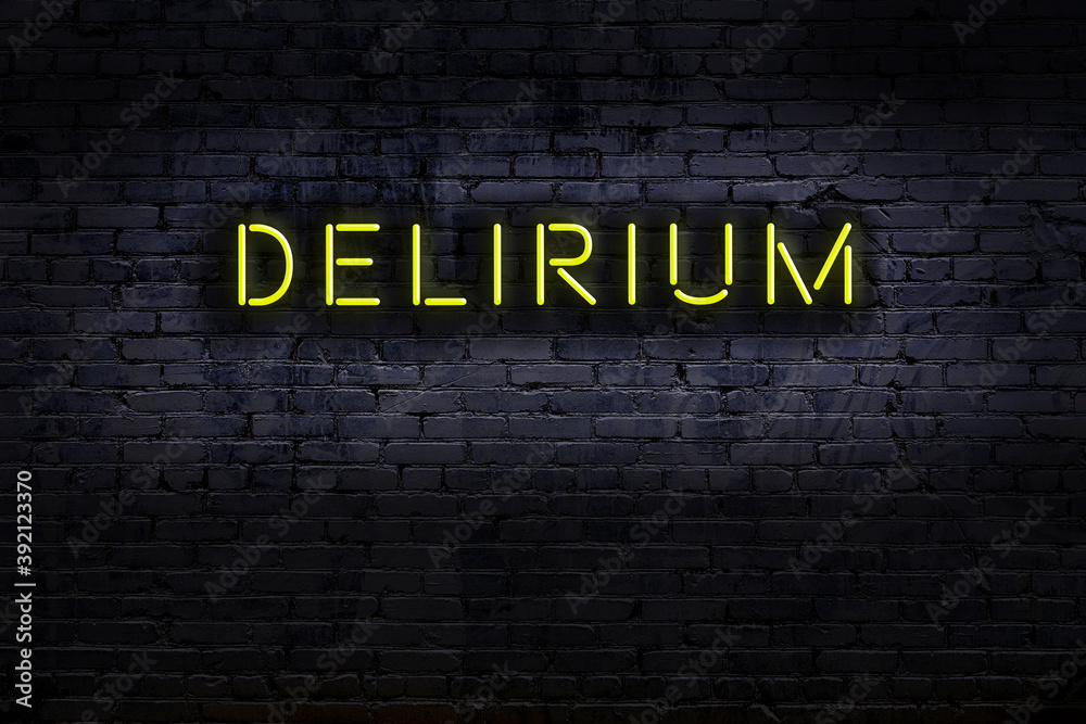Neon sign. Word delirium against brick wall. Night view - obrazy, fototapety, plakaty 