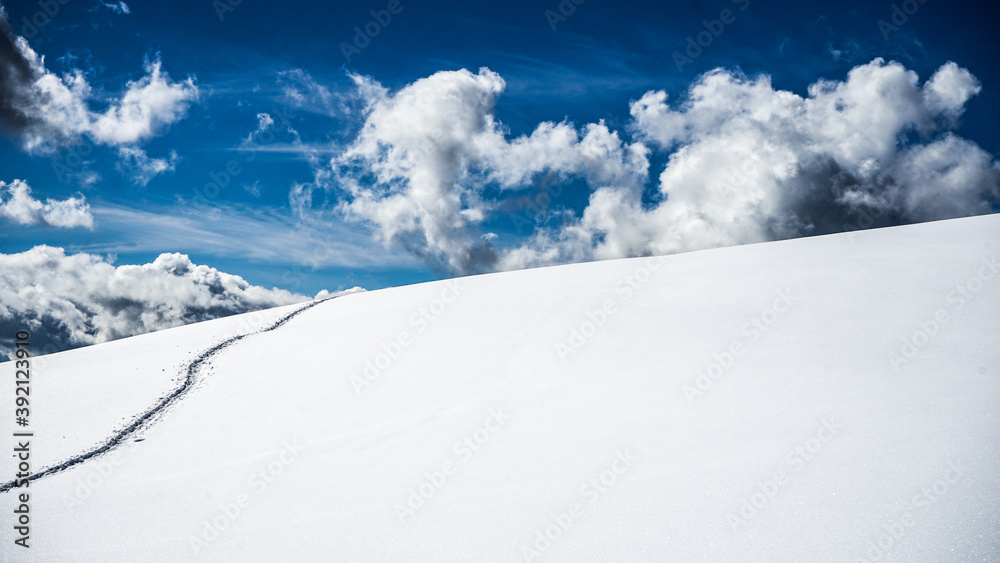 RELAXING SCENERY OF SNOW UNDER A BLUE SKY IN DOLOMITES