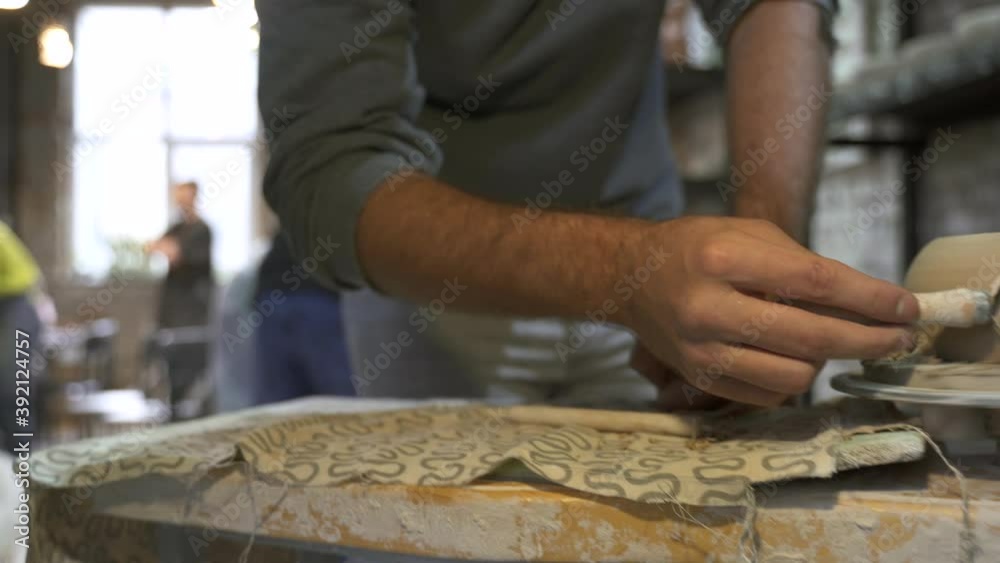 Making a handmade clay pot in the workshop. Pottery lesson with master. Making a handmade clay pot in the workshop. Pottery lesson with master.