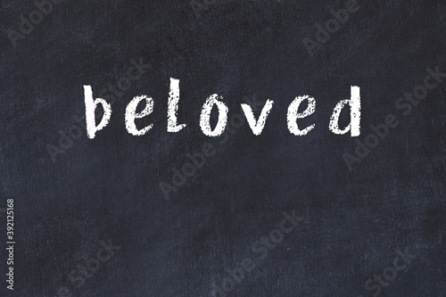 College chalk desk with the word beloved written on in