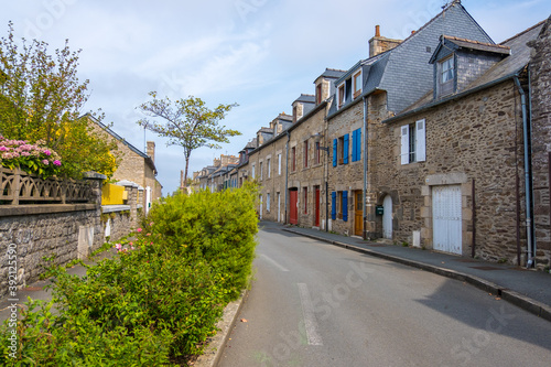 Dinan  France - August 26  2019  Old street with stone medieval houses in the historic town centre of Dinan  French Brittany