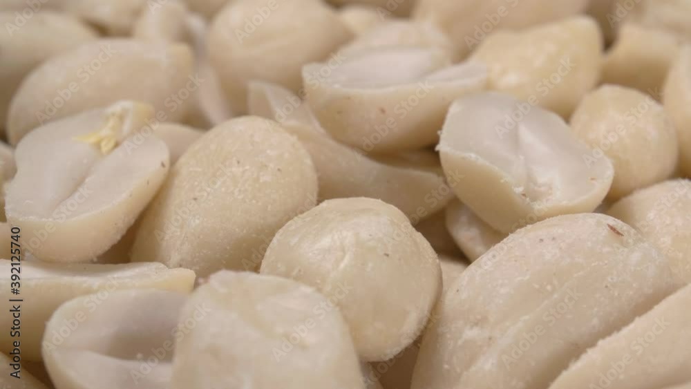 Peeled peanut kernels close-up. Lots of nuts. Fried kernels. Peeled peanut kernels close-up. Lots of nuts. Fried kernels.