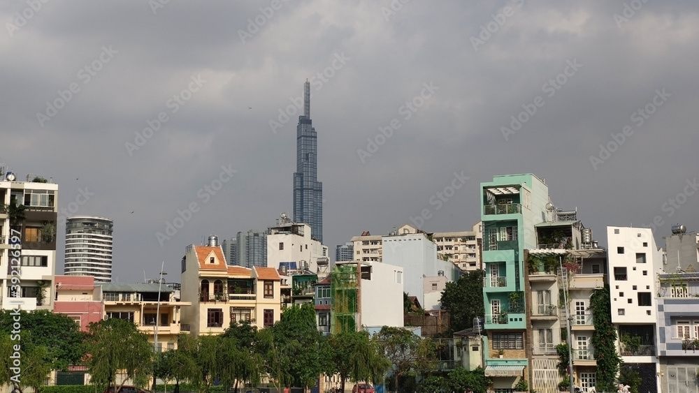 Landmark 81 the highest buildng in Vietnam. Ho Chi Minh City (Saigon). Skyscrapers and residential houses. View from the park. South-East Asia