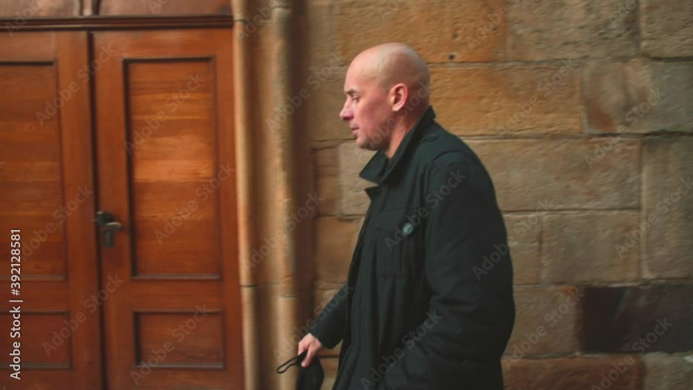 A man in a black coat walks along the stone city wall. Bald head is not reason for an inferiority complex. Find a drugs to treat male pattern baldness and reverse hair loss with of men. A man in a black coat walks along the stone city wall. Bald head is not reason for an inferiority complex. Find a drugs to treat male pattern baldness and reverse hair loss with of men.