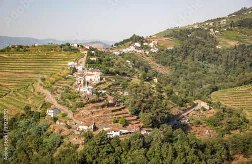 a view of Boavista village (Vila Marim) on the slope of a green mountain, municipality of Mesao Frio, district of Vila Real, Douro, Portugal photo