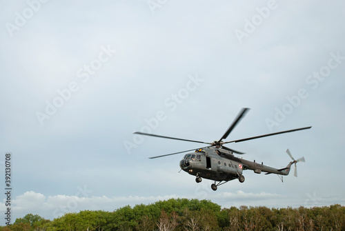 Mi-8 halicopter above the treetops. Photo taken after the parachute jumping show during the Commando Fest in Dziwnów - August 22, 2020. Public show - everyone could photograph without restrictions.