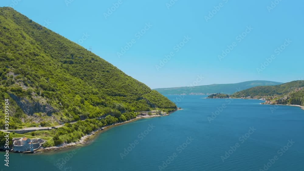 Perast, Montenegro. Aerial panoramic view of the beautiful seascape and mountains. Was filmed at summer day Perast, Montenegro. Aerial panoramic view of the beautiful seascape and mountains. Was filmed at summer day