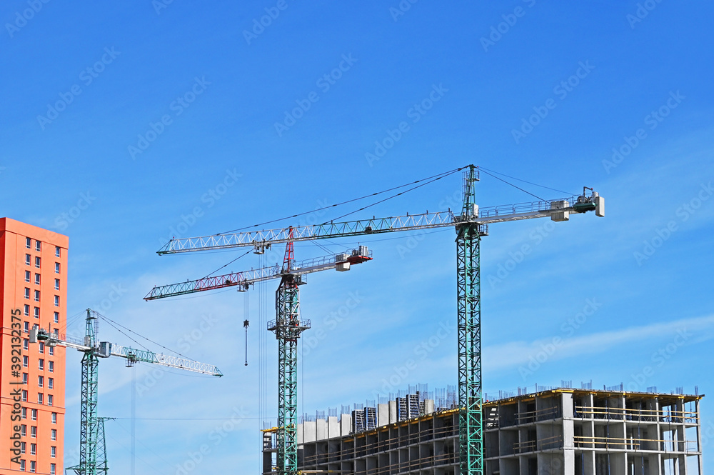 Crane and highrise construction site Crane and highrise construction site