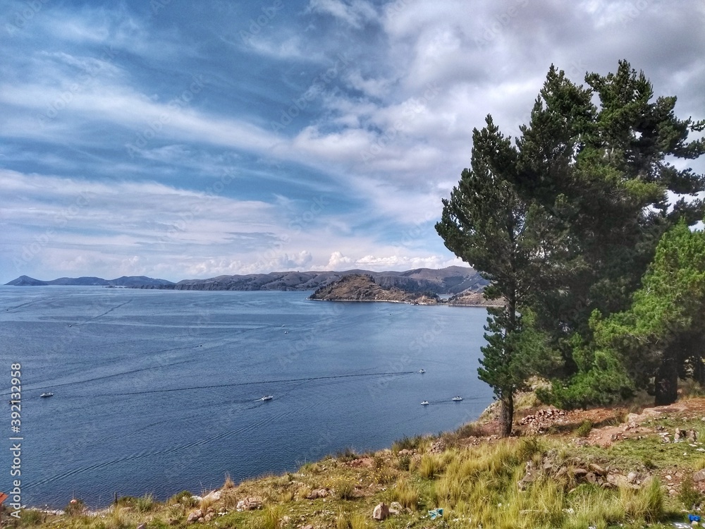 Fototapeta premium Lago Titicaca, Copacabana, Bolivia - Lake Titicaca, Between Peru and Bolivia in the Andes Mountains, is one of South America's largest lakes and the world’s highest navigable body of water. 