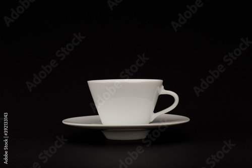 Cup of coffee on black background