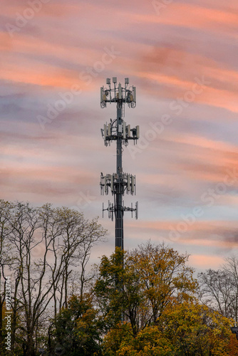 Silhouette signal antenna tower at beautiful sunrise sky background energy 5g satelllite photo