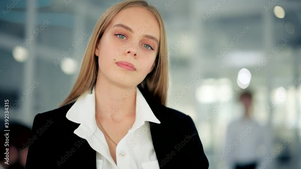 Portrait of young charming female office manager looking to camera and having good mood. Concept of work , business, it industry Portrait of young charming female office manager looking to camera and having good mood. Concept of work , business, it industry