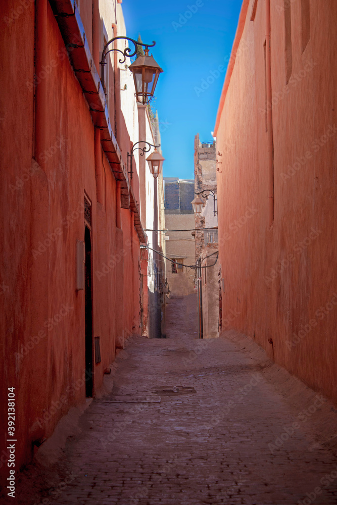 Traditional, tipical narrow reddish brown street of Marrakech Medina
