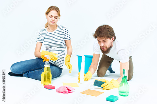 family washing floors cleaning supplies cleaning together homework