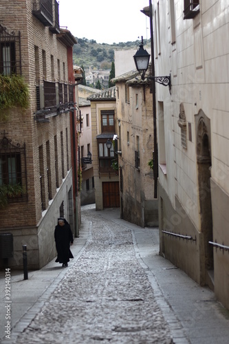 Alleyway in Spain with Nun