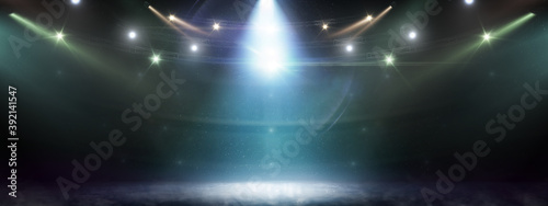 Hockey rink background. Searchlights. Stage for presentation illuminated by spotlights. Lights abstract background