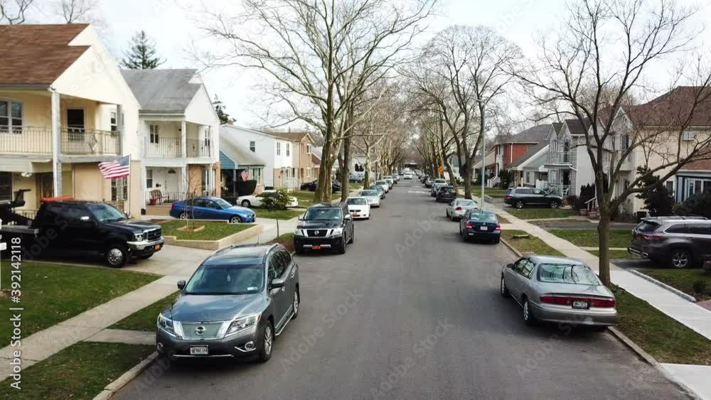 Aerial Shot of a Suburban Neighborhood Street - Pullback View Aerial Shot of a Suburban Neighborhood Street - Pullback View