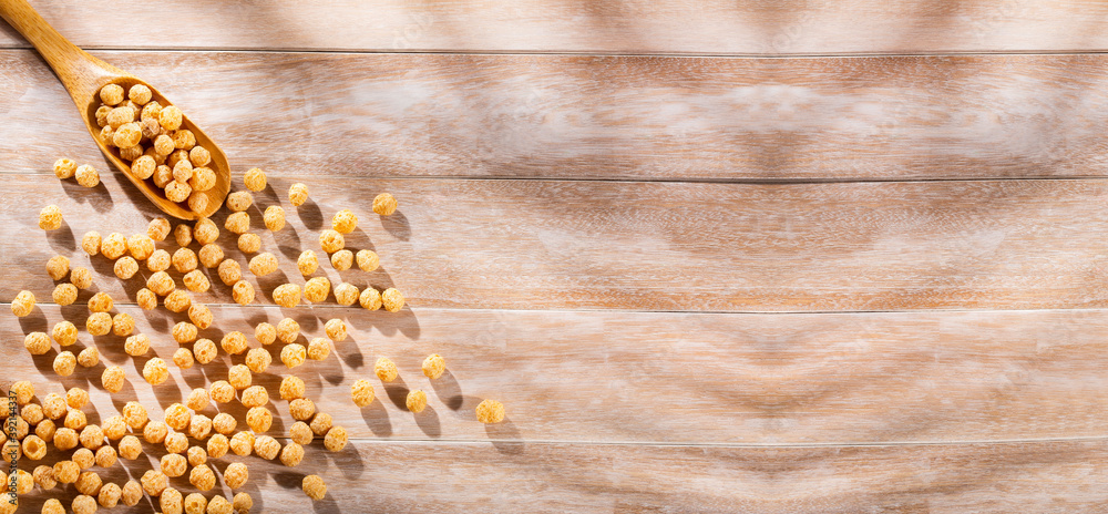 Chenopodium quinoa cereal in the wooden spoon Chenopodium quinoa cereal in the wooden spoon