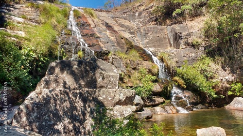 Tiny waterfall waters