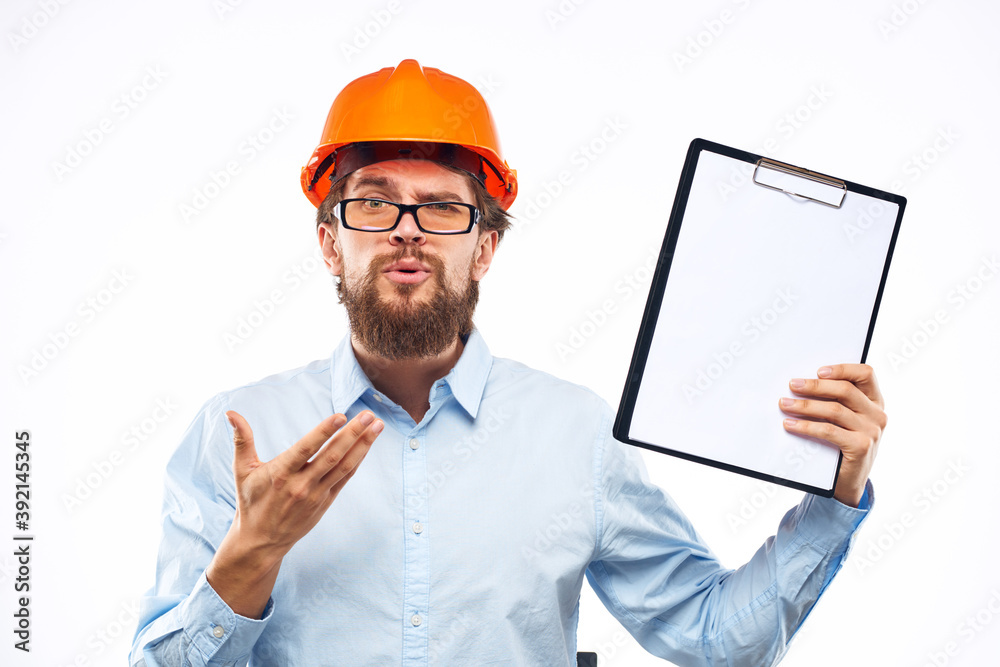 engineer orange helmet safety professional manual in hand cropped view engineer orange helmet safety professional manual in hand cropped view