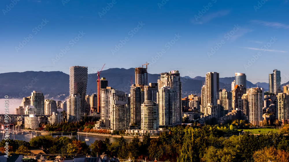 Obraz premium Skyline of Downtown Vancouver, British Columbia, Canada at Sunset. Viewed from the South Shore of Falls Creek