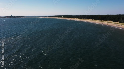 Wallpaper Mural Aerial view of people parasailing, at a beach, warm, windy, summer day, in Scandinavia - reverse, drone shot Torontodigital.ca