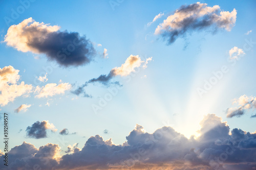 Cloudscape with Sunlight Rays Behind Clouds