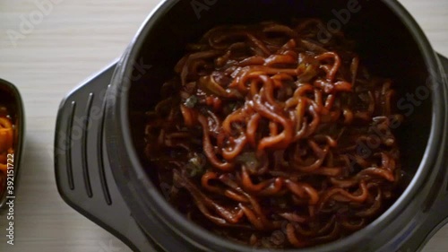 Korean black spaghetti or instant noodle with roasted chajung soybean sauce (chapagetti) - Korean food style photo