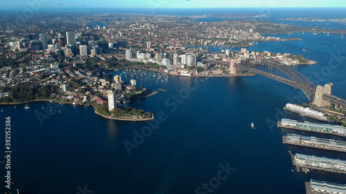 Panoramic Aerial views of Sydney Harbour with the bridge  CBD  North Sydney  Barangaroo  Lavender Bay and boats in view