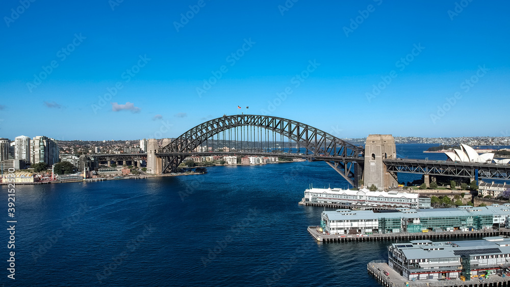 Panoramic Aerial views of Sydney Harbour with the bridge, CBD, North Sydney, Barangaroo, Lavender Bay and boats in view