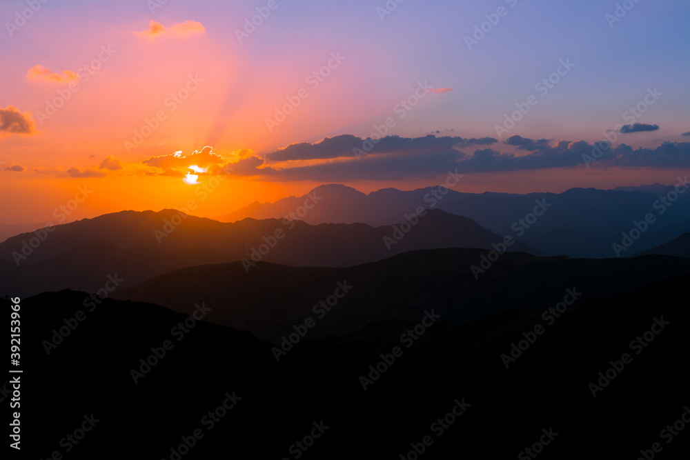 Fototapeta premium mountain sunset with dramatic clouds