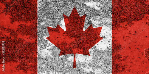 Flag of Canada painted on the old grunge rustic iron surface. Abstract paint of Canadian national flag on the iron surface