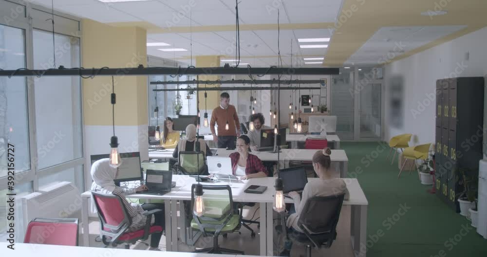 Young people of diverse ethnicity working in a modern office in daytime Young people of diverse ethnicity working in a modern office in daytime