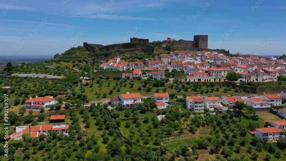 Aerial view of the Monsaraz Castle on a hill overlooking countryside, Portugal.