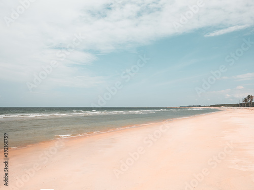empty sandy tropical beach. wide beach on island. copy space provided.