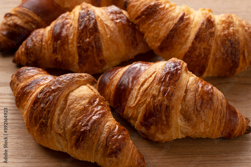 Croissants on a wooden background