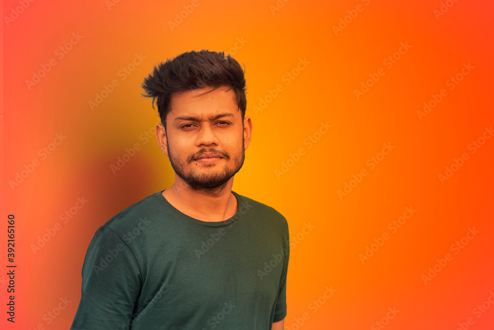 Young Indian man wearing t-shirt standing over isolated yellow background ,smiling relaxed and cheerful. Success and optimistic Young Indian man wearing t-shirt standing over isolated yellow background ,smiling relaxed and cheerful. Success and optimistic