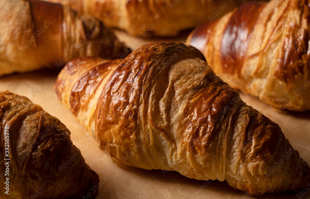 Close-up of a croissant placed on kitchen paper