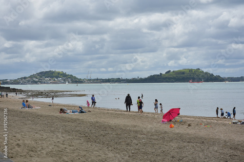 AUCKLAND, NEW ZEALAND - Nov 01, 2020: people on Mission Bay Beach photo