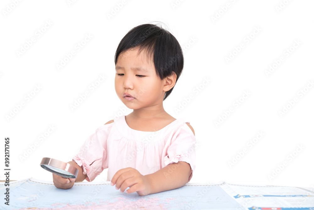 Little Chinese girl holding a magnifying glass in hand observing map in front of white background Little Chinese girl holding a magnifying glass in hand observing map in front of white background